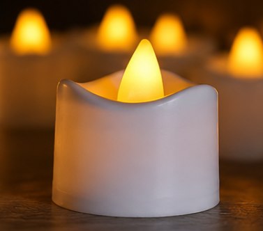Close-up of one LED tea light glowing